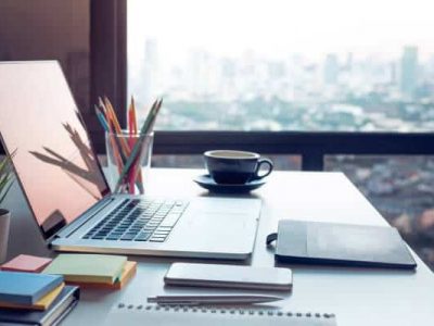 Modern work table with computer laptop and cityscapes viewfrom window.Business concepts ideas.Strategy analysis